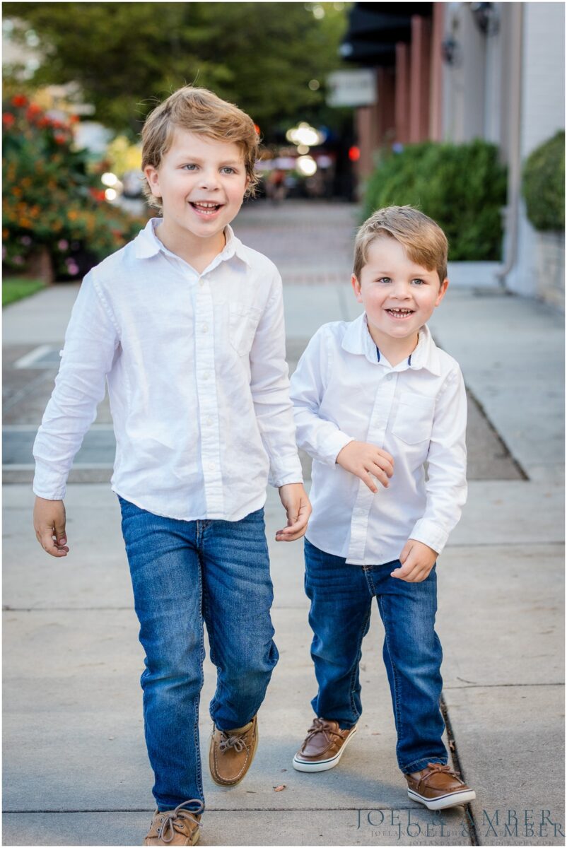 It's fall mini session season and we're here for it! The first on our calendar was a light and airy classic downtown look. Perfect backdrop for these sweet families!